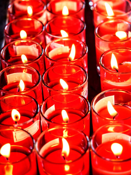 istock red candle burns in the glass. 679993426