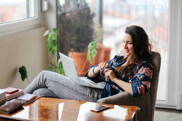 istock Young woman working at home at the laptop 679993996