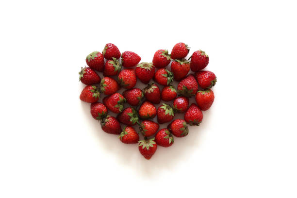 istock A heart from strawberry on the white background. 680001826