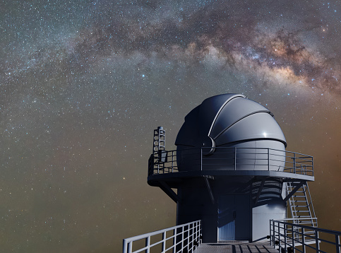 Frederick C. Gillett Gemini North telescope open for evening viewing just as stars begin to emerge in sky on the summit of Mauna Kea. Hawaii, USA.