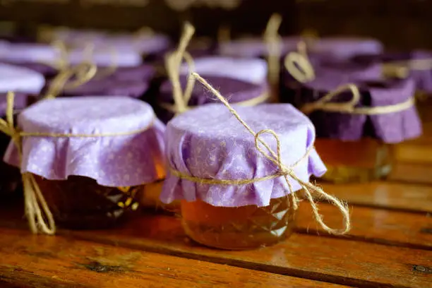 Party favors of local Oregon honey at a wedding reception.