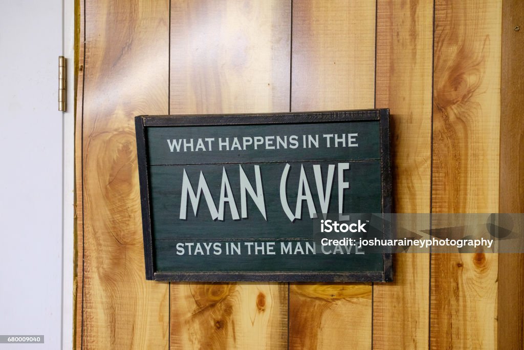 Handmade Wedding Sign Man Cave sign says that what happens in the mancave stays there. Man Cave Stock Photo