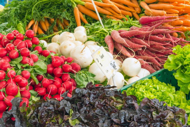 istock Carrots, radish and other vegetables for sale 680019364