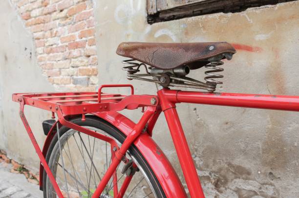 istock bicycle red  classic vintage in former on wall wood background with copy space for add text 680019800