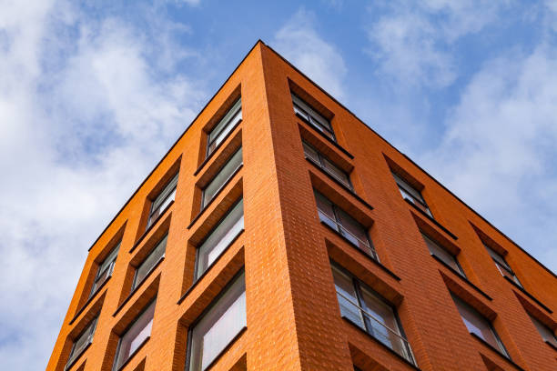 istock Modern brick business building. Roof, windows and sky. 680028660