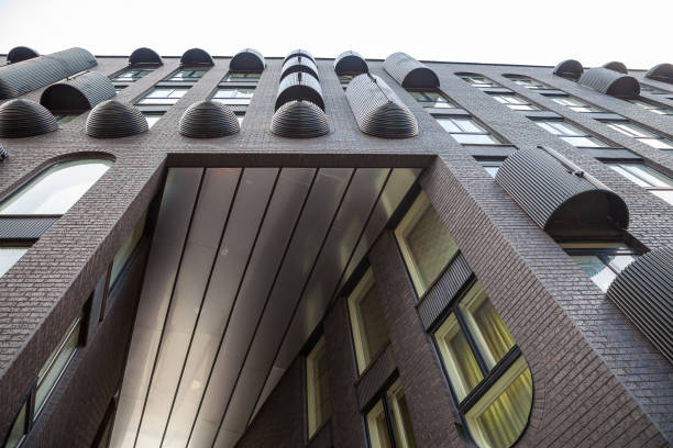 istock Ulltra modern dark grey brick business building with rich exterior decorations. 680028674