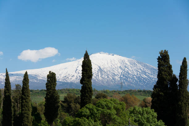 istock snow on mountain etna, big italian volcano, seen from the plain 680031540