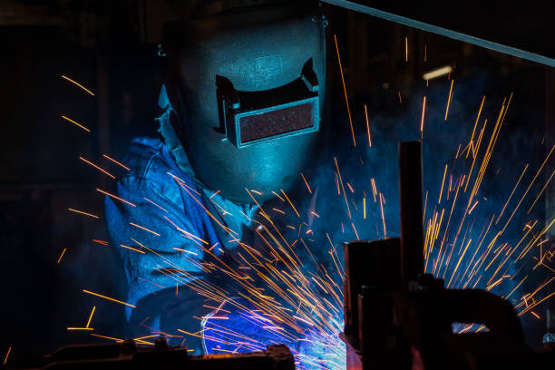 istock industrial worker is welding assembly car part in factory 680032112