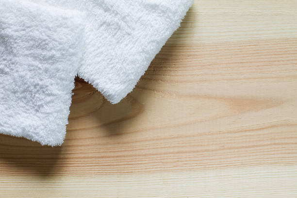 istock White towels on vintage wooden background,top view 680040102
