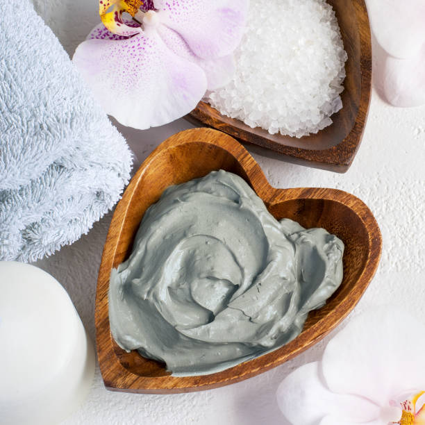 istock Cosmetic face and body mask of blue clay. Spa setting 680048326