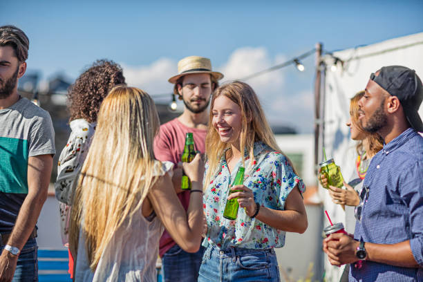 istock Happy friends having beer at terrace party 680056440