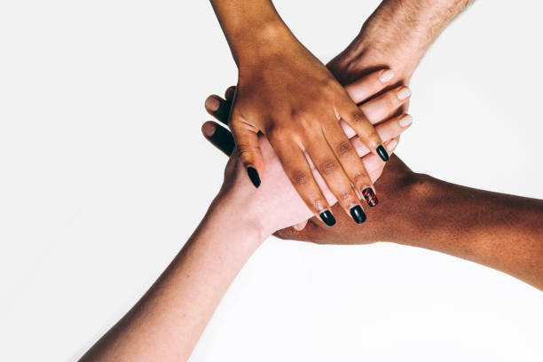 istock Black and white hands, international friendship 680057852