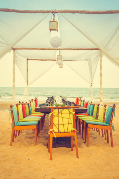 istock Table and chair set on the beach for dinner 680058028