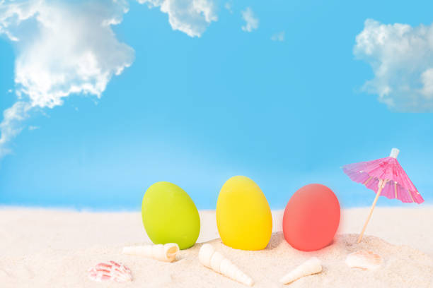 istock colorful eggs on white sand beach over cloudy sky 680058836