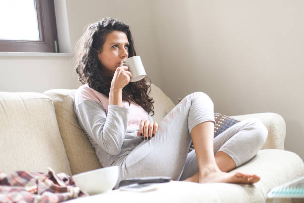 istock Woman drinking hot drink 680059138