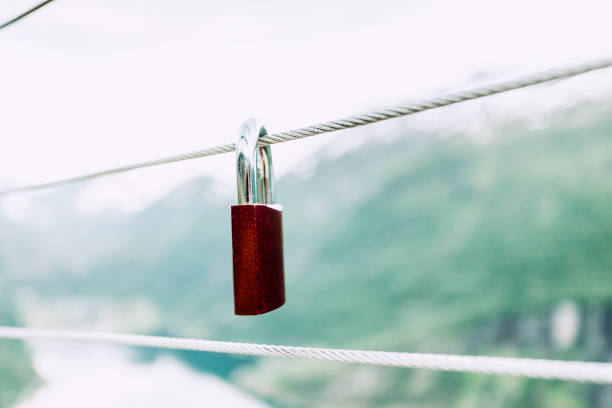 istock Red padlock and Geirangerfjord from Flydasjuvet viewpoint Norway 680059874