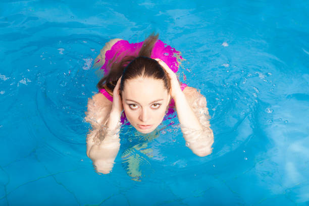 istock Woman having fun in swimming pool 680064356