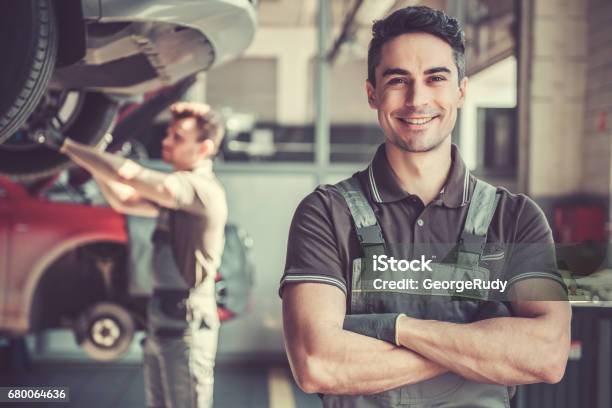 At The Auto Service Stock Photo - Download Image Now - Mechanic, Machinery, Car