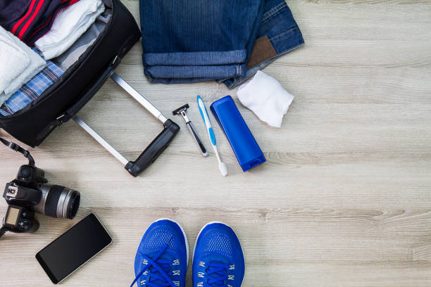 istock Travelling bag,camera,smartphone and men accessories on wooden background 680068744