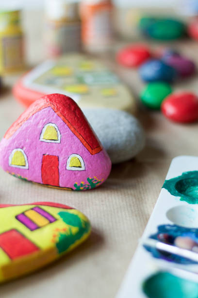 istock homemade painted stone as a pink home 680068990
