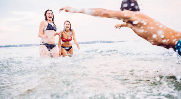 istock Friends having fun in the sea 680071086
