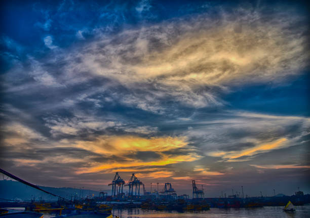 This shot was taken at the fishing harbor where the clouds were taken different shapes.