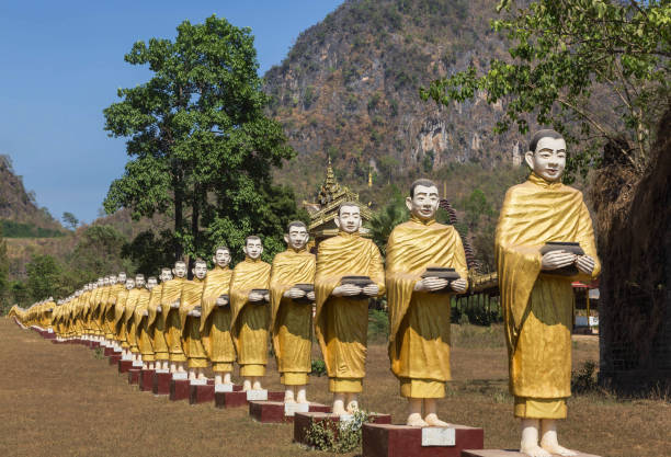 istock many buddha statues standing in row in  Myanmar (Burma) 680079496