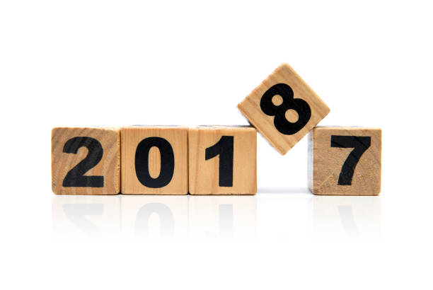 istock New Year 2018 and Old 2017 with wood block isolated 680080776