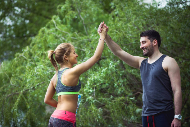 istock Happy athletes taking a break from exercising in nature. 680082196
