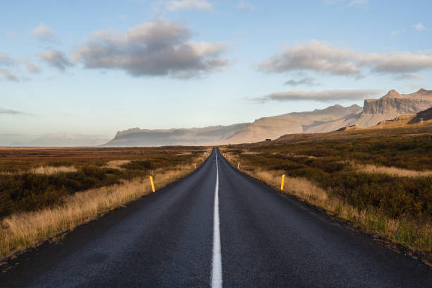 istock Empty road with maks in Iceland. Great mountain range in the background. Lonley place. Silence. 680082678
