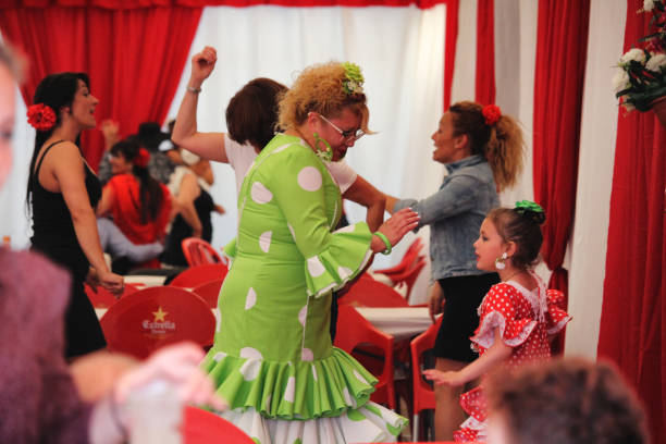 April Fair Barcelona Barcelona, Spain - May 6, 2017: Flamenco dressed ladies participating at the Feria de Abril in Barcelona's Diagonal Mar district avenida diagonal stock pictures, royalty-free photos & images