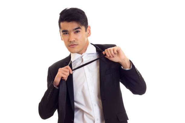 istock Young man in suit fixing his tie 680094260