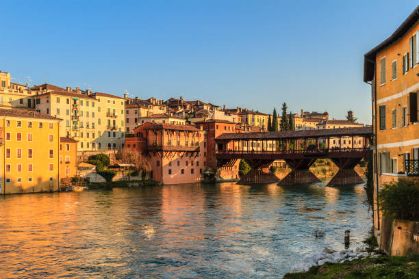 Old town of Bassano del Grappa along the river Brenta with the famous Ponte degli Alpini. Province of Vicenza, Italy stock photo
