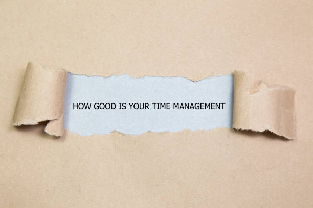 istock The word HOW GOOD IS YOUR TIME MANAGEMENT appearing behind torn paper 680103494