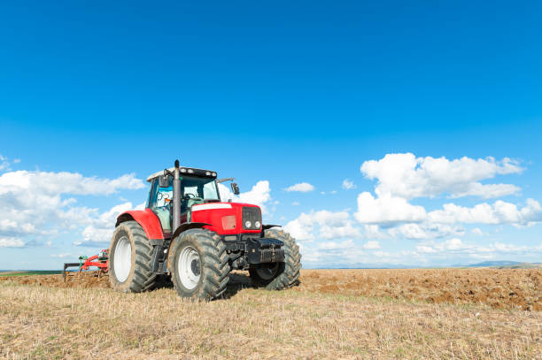 istock tractor in the lands along with gear for work 680105036