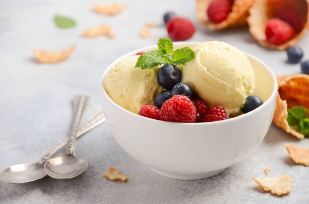 istock Vanilla ice cream with fresh berries on concrete background 680111390