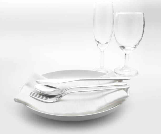 istock fork and knife on red napkin and wine glasses 680122918