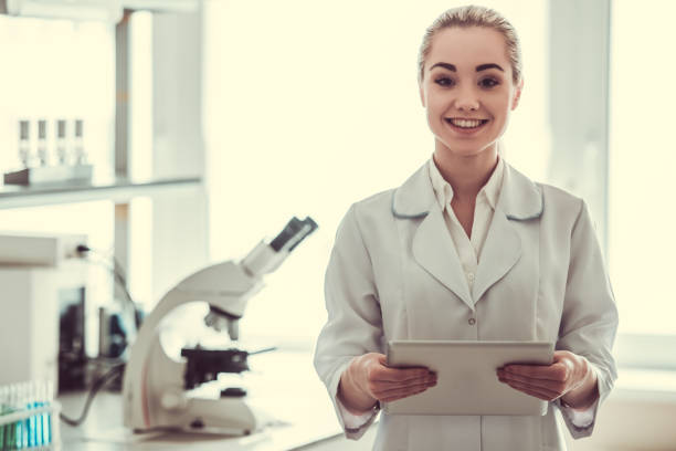 istock Beautiful female doctor in laboratory 680124808