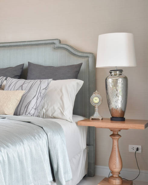 istock luxury bedroom interior with decorative table lamp and alarm clock on bedside table 680125764