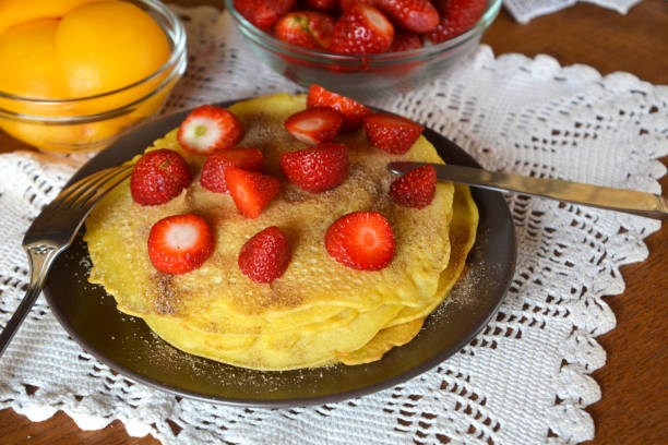 istock Stack of fresh homemade pancakes decorated on a brown plate. 680138330