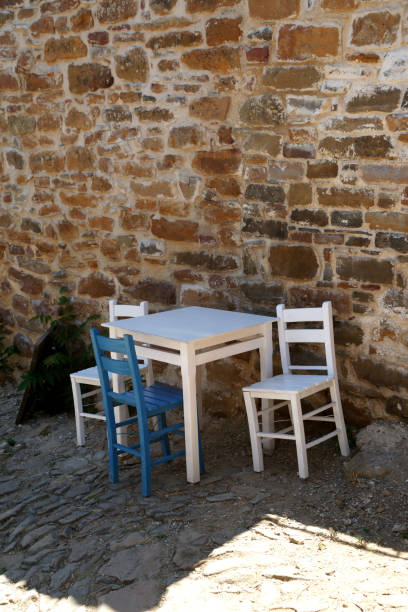 istock Blue and white chairs and table on street 680141432