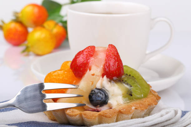 One fruit cake and teacup stock photo