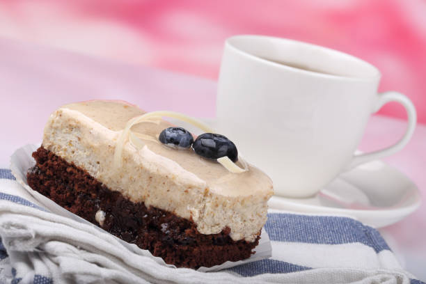 One fruit cake and teacup stock photo