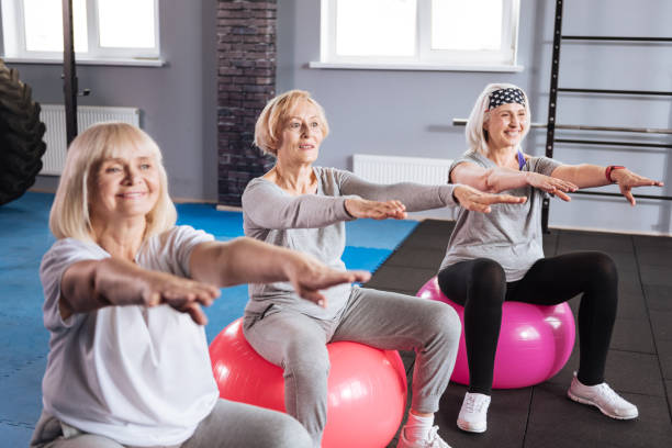 istock Joyful active women exercising on fitness balls 680142010