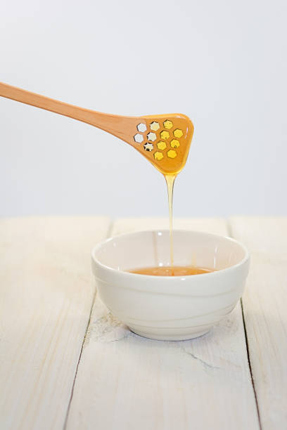 istock Bowl is filled with flower honey 680145608