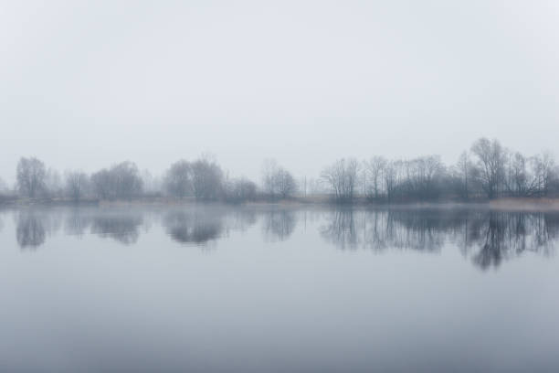 istock heavy mist over the river in autumn 680162582