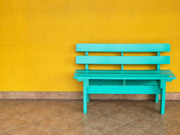istock Green chair and yellow wall 680165716