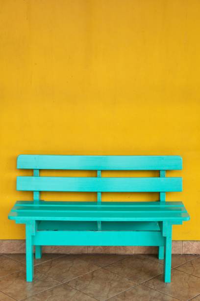 istock Green chair and yellow wall 680165740
