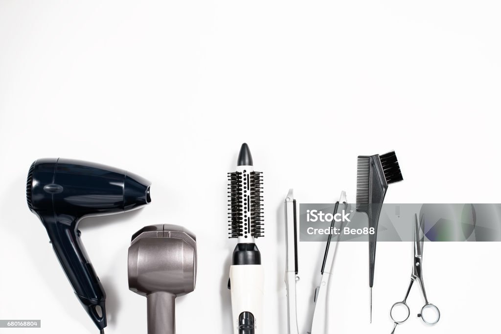 Various hair styling devices on white background, top view Various hair styling tools on white background, top view, copy space Work Tool Stock Photo