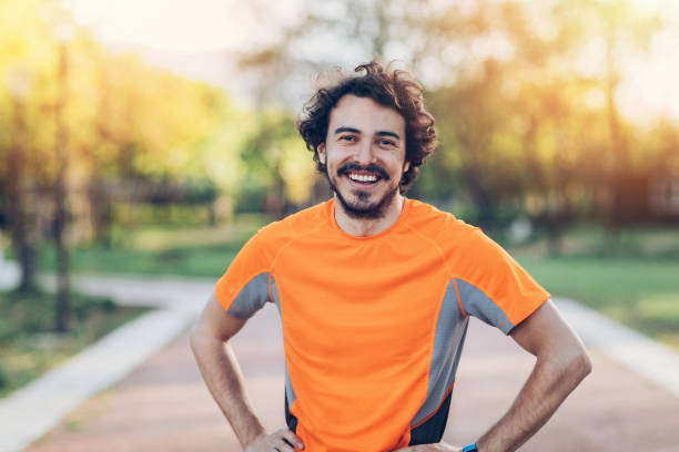 istock Smiling athlete in the park 680169486